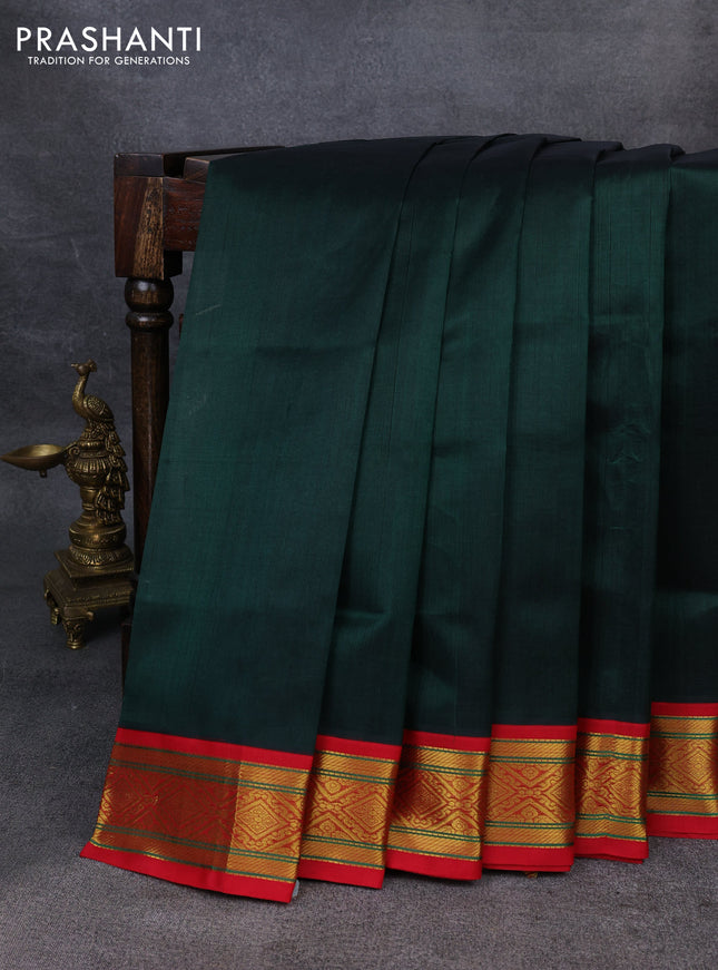 Silk Cotton saree dark green and red with plain body and zari woven korvai border