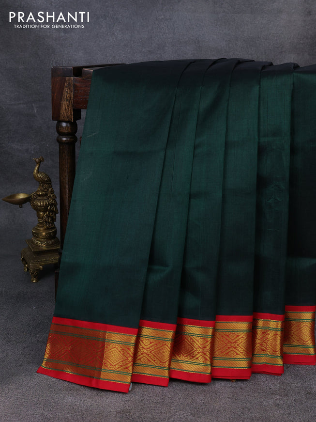 Silk Cotton saree dark green and red with plain body and zari woven korvai border