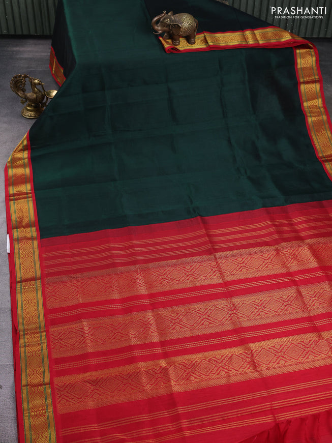 Silk Cotton saree dark green and red with plain body and zari woven korvai border