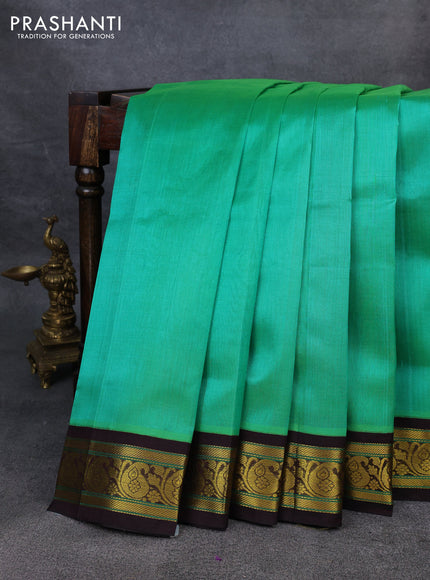 Silk Cotton saree teal green and coffee brown with plain body and zari woven korvai border