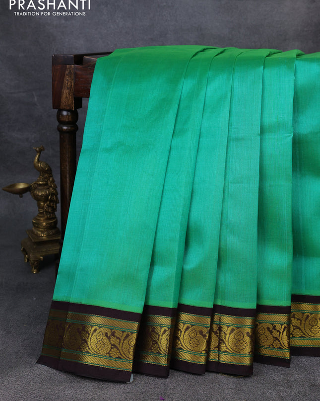 Silk Cotton saree teal green and coffee brown with plain body and zari woven korvai border