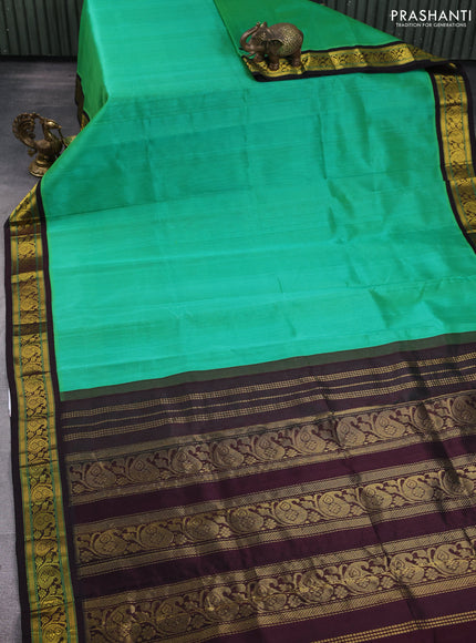 Silk Cotton saree teal green and coffee brown with plain body and zari woven korvai border