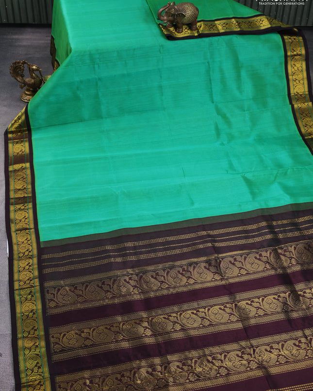 Silk Cotton saree teal green and coffee brown with plain body and zari woven korvai border