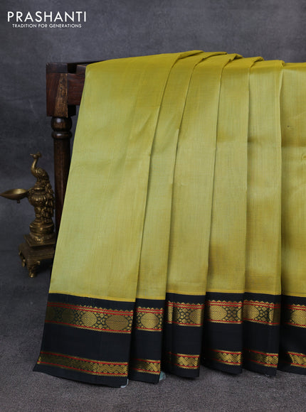 Silk Cotton saree pista green and dark green with plain body and zari woven korvai border