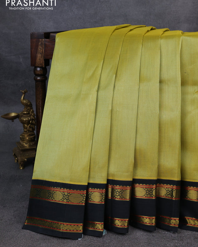 Silk Cotton saree pista green and dark green with plain body and zari woven korvai border