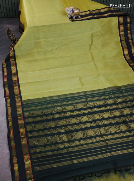 Silk Cotton saree pista green and dark green with plain body and zari woven korvai border