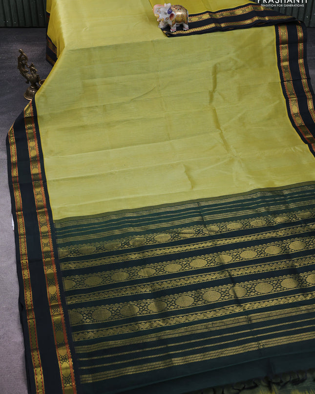 Silk Cotton saree pista green and dark green with plain body and zari woven korvai border