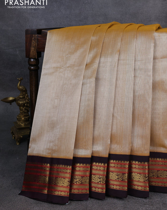 Silk Cotton saree sandal and deep purple with plain body and zari woven korvai border