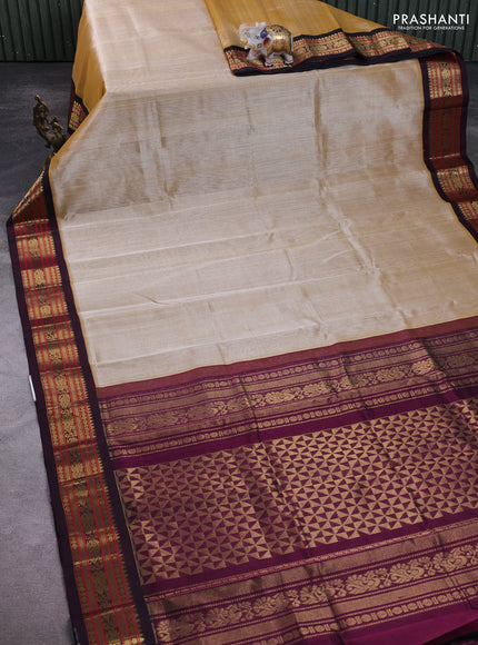 Silk Cotton saree sandal and deep purple with plain body and zari woven korvai border