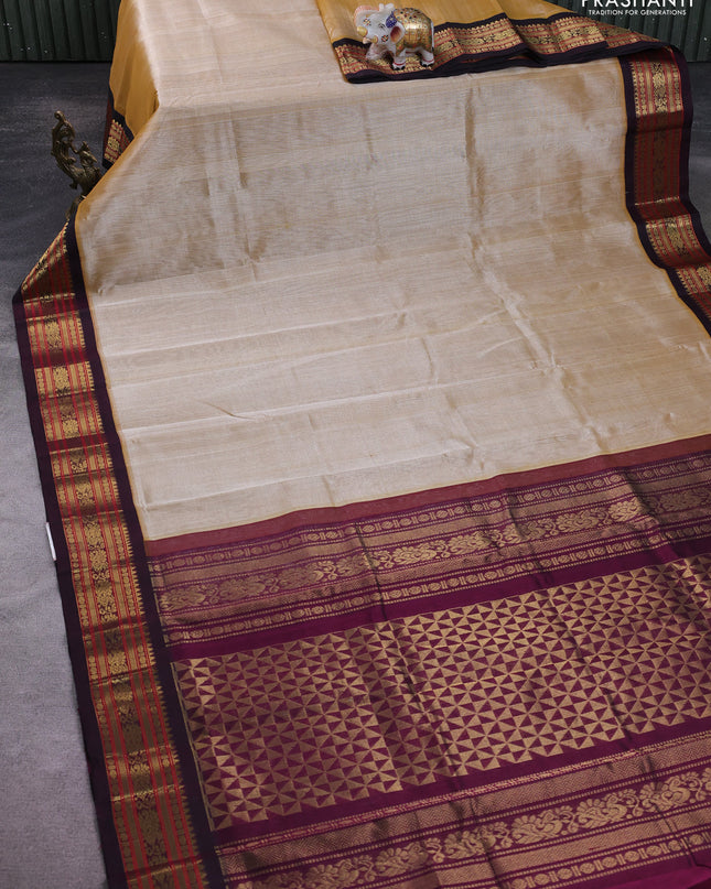 Silk Cotton saree sandal and deep purple with plain body and zari woven korvai border