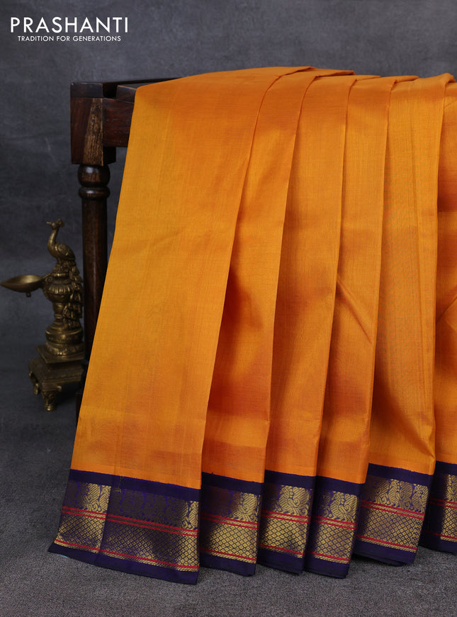 Silk Cotton saree mango yellow and blue with plain body and zari woven korvai border