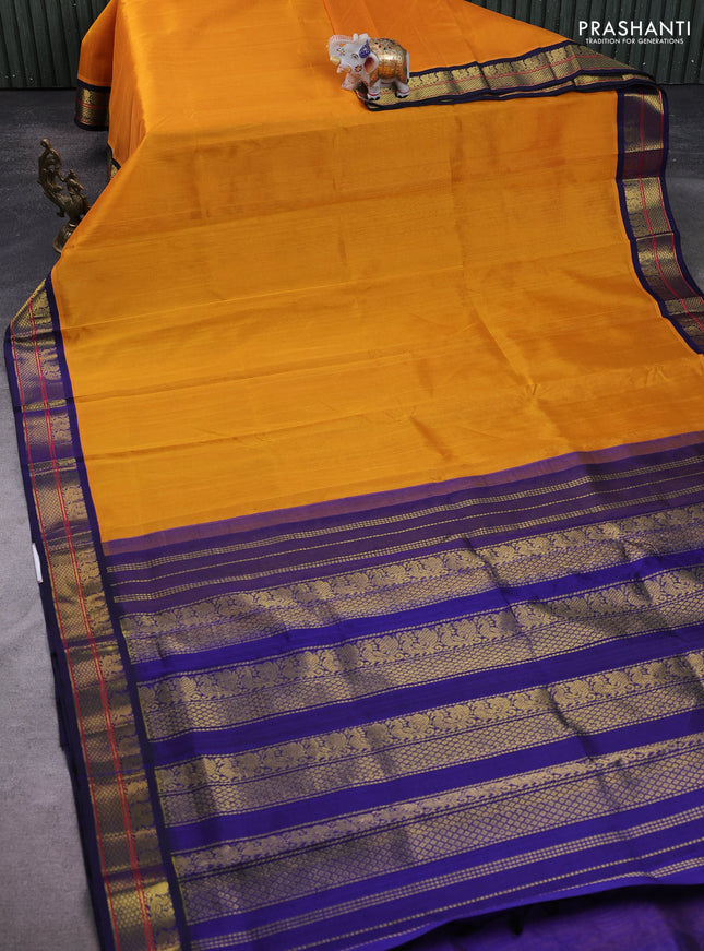 Silk Cotton saree mango yellow and blue with plain body and zari woven korvai border