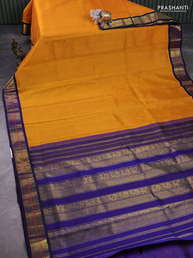Silk Cotton saree mango yellow and blue with plain body and zari woven korvai border