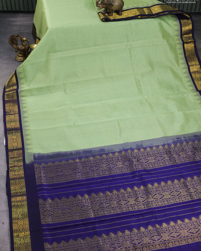 Silk Cotton saree pista green and blue with zari woven buttas and zari woven korvai border