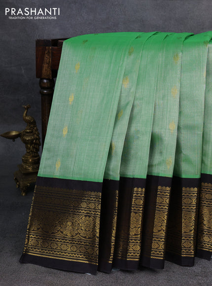Silk Cotton saree pastel green and black with zari woven buttas and zari woven border