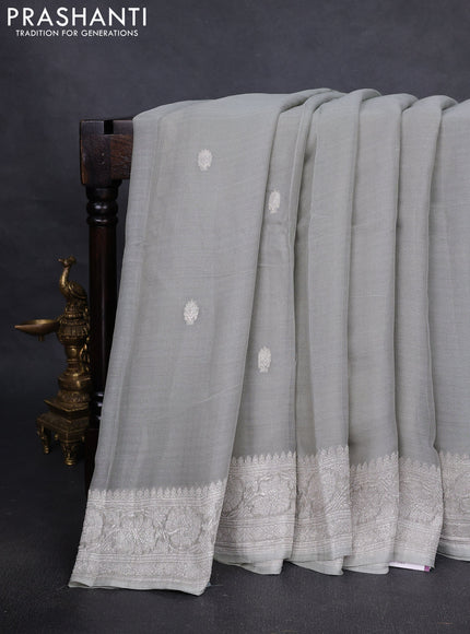 Pure banarasi chiffon silk saree pista green with silver zari woven buttas and silver zari woven borderPure banarasi chiffon silk saree pista green with silver zari woven buttas and silver zari woven border