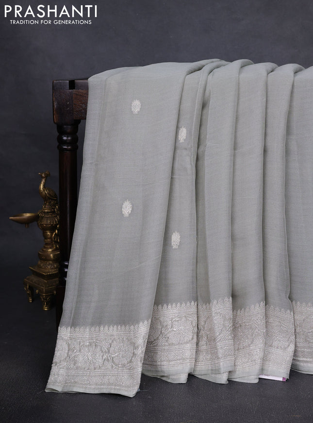 Pure banarasi chiffon silk saree pista green with silver zari woven buttas and silver zari woven borderPure banarasi chiffon silk saree pista green with silver zari woven buttas and silver zari woven border
