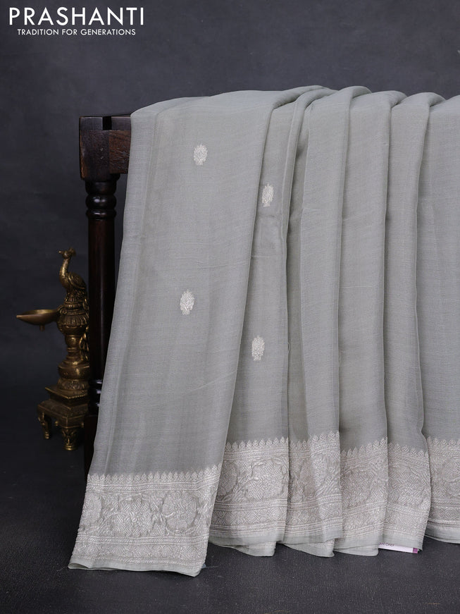Pure banarasi chiffon silk saree pista green with silver zari woven buttas and silver zari woven borderPure banarasi chiffon silk saree pista green with silver zari woven buttas and silver zari woven border