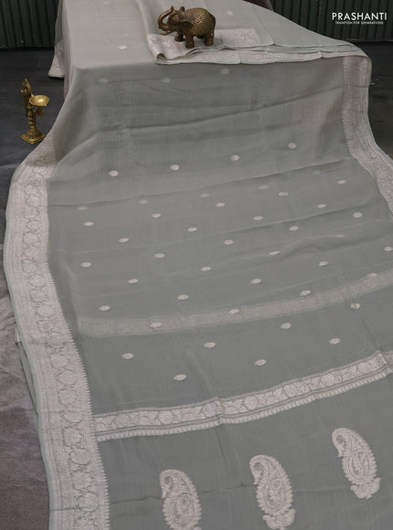 Pure banarasi chiffon silk saree pista green with silver zari woven buttas and silver zari woven borderPure banarasi chiffon silk saree pista green with silver zari woven buttas and silver zari woven border