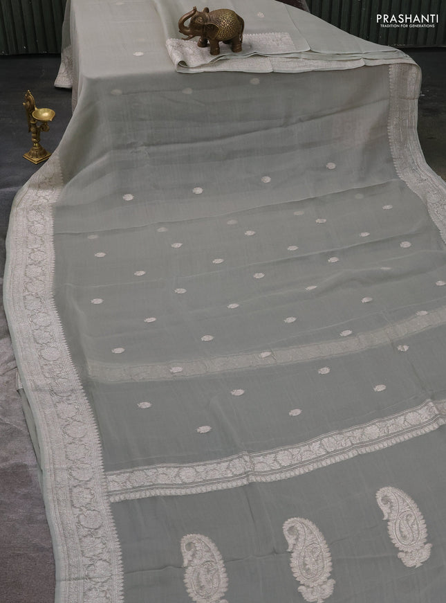 Pure banarasi chiffon silk saree pista green with silver zari woven buttas and silver zari woven borderPure banarasi chiffon silk saree pista green with silver zari woven buttas and silver zari woven border