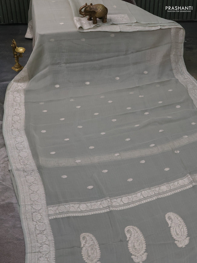 Pure banarasi chiffon silk saree pista green with silver zari woven buttas and silver zari woven borderPure banarasi chiffon silk saree pista green with silver zari woven buttas and silver zari woven border