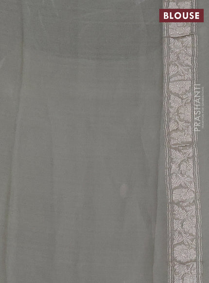 Pure banarasi chiffon silk saree pista green with silver zari woven buttas and silver zari woven borderPure banarasi chiffon silk saree pista green with silver zari woven buttas and silver zari woven border