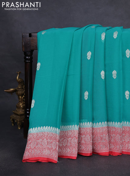 Pure banarasi chiffon silk saree teal blue and peach orange with silver zari woven buttas and silver zari woven border