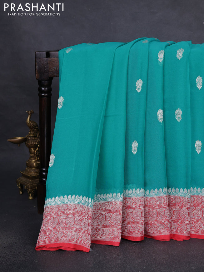 Pure banarasi chiffon silk saree teal blue and peach orange with silver zari woven buttas and silver zari woven border