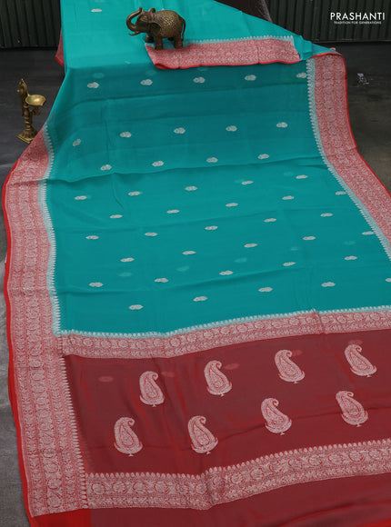 Pure banarasi chiffon silk saree teal blue and peach orange with silver zari woven buttas and silver zari woven border