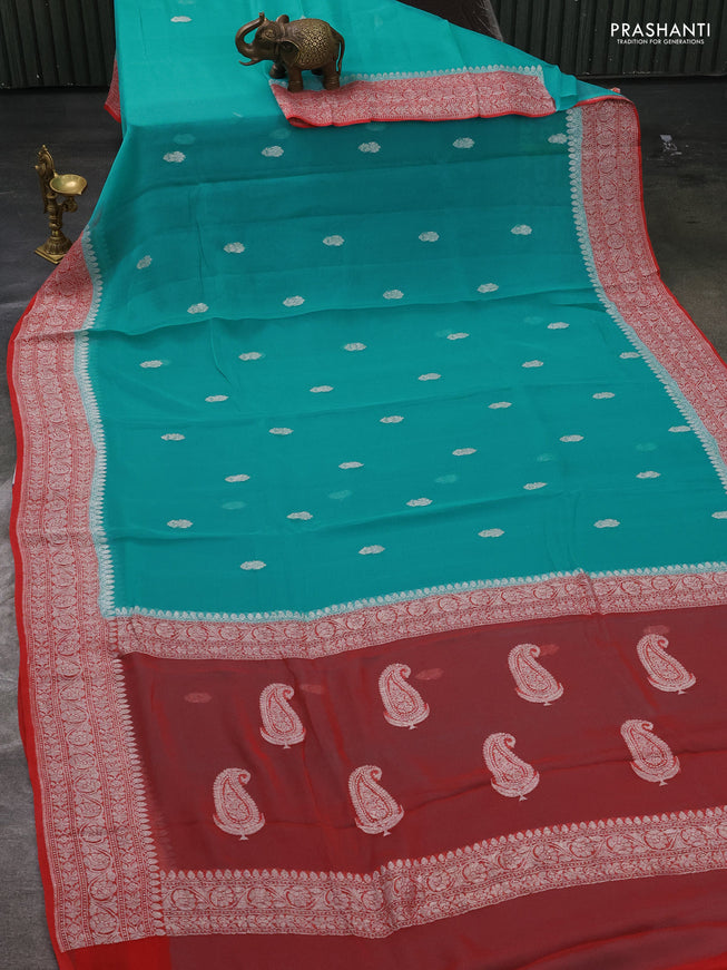 Pure banarasi chiffon silk saree teal blue and peach orange with silver zari woven buttas and silver zari woven border