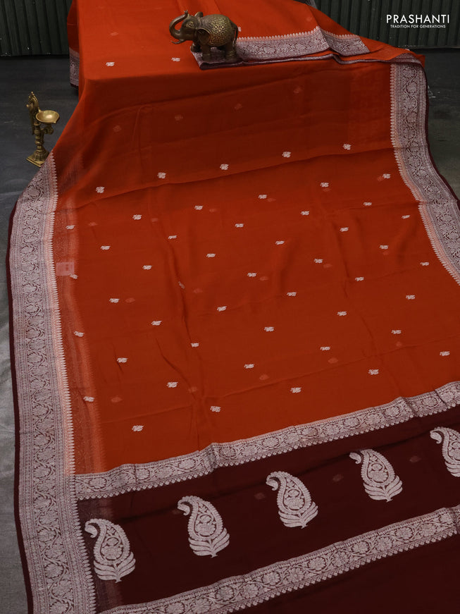 Pure banarasi chiffon silk saree orange and deep maroon with silver zari woven buttas and silver zari woven border