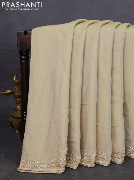 Tissue saree pista green with plain body and embroidery border