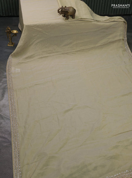Tissue saree pista green with plain body and embroidery border