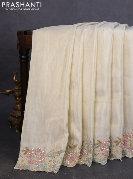Tissue saree cream with plain body and embroidery border