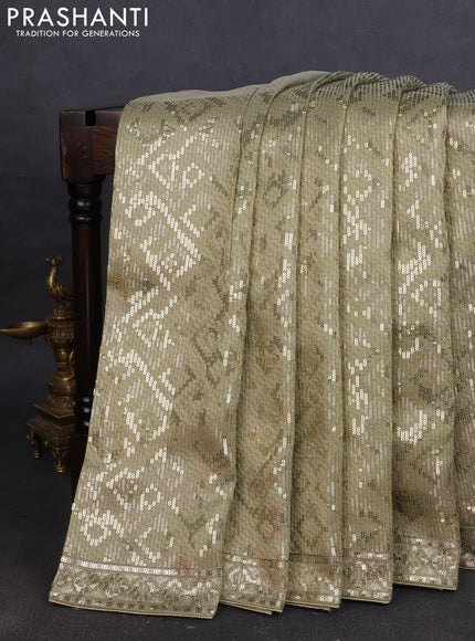 Banarasi silk saree pista green with allover sequin work
