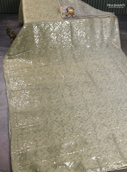 Banarasi silk saree pista green with allover sequin work