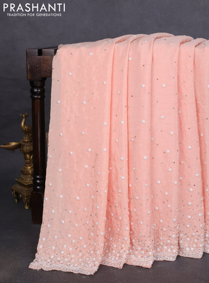 Crepe saree mild peach with beaded work
