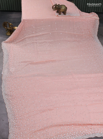 Crepe saree mild peach with beaded work