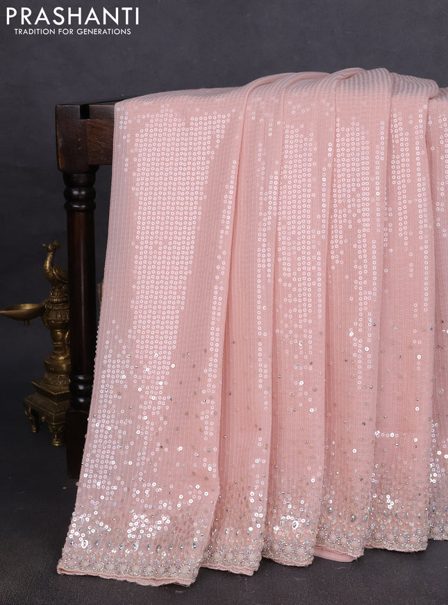 Georgette saree mild peach with allover sequin work