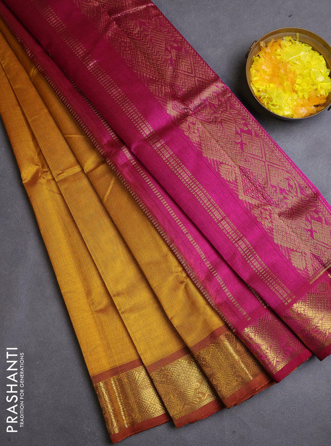 Silk cotton saree mustard yellow and magenta pink with plain body and zari woven border