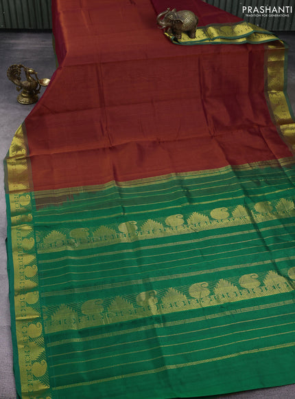 Silk cotton saree rust and green with plain body and zari woven border