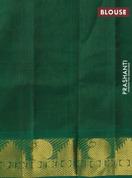 Silk cotton saree rust and green with plain body and zari woven border