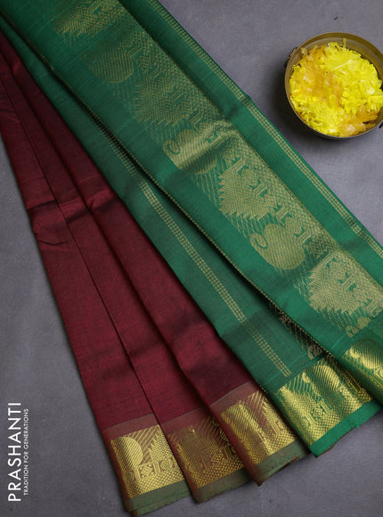 Silk cotton saree maroon and green with plain body and zari woven border