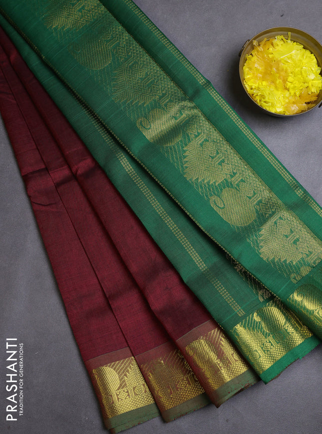 Silk cotton saree maroon and green with plain body and zari woven border