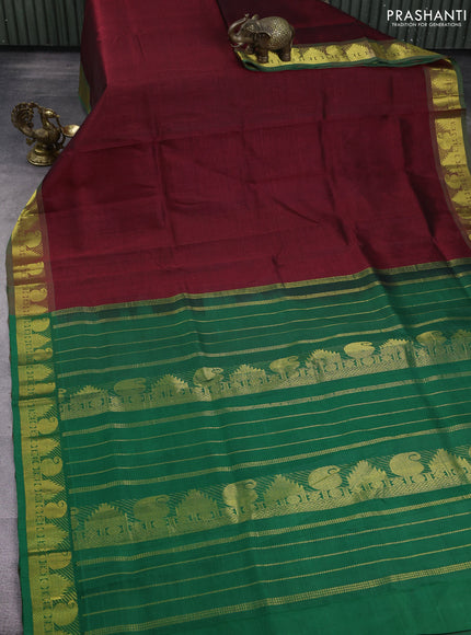 Silk cotton saree maroon and green with plain body and zari woven border