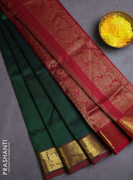 Silk cotton saree dark green and maroon with plain body and zari woven border