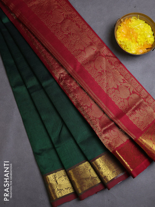 Silk cotton saree dark green and maroon with plain body and zari woven border