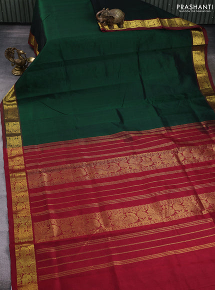 Silk cotton saree dark green and maroon with plain body and zari woven border