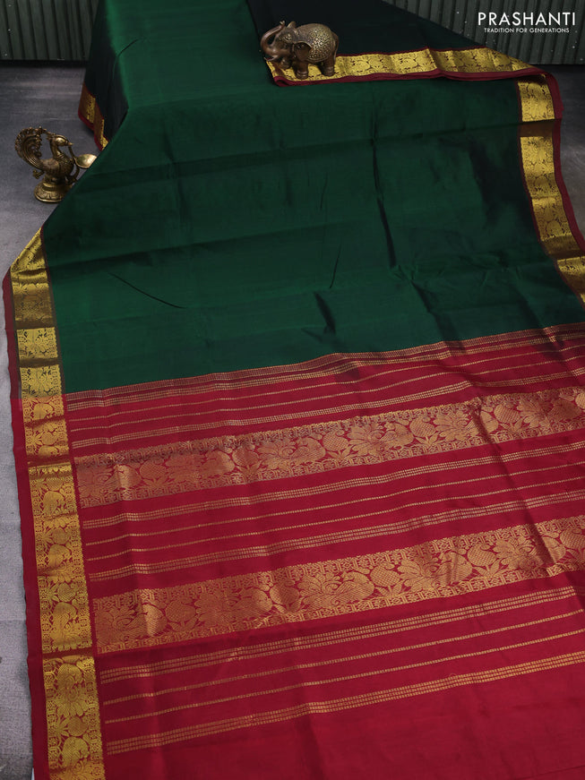 Silk cotton saree dark green and maroon with plain body and zari woven border