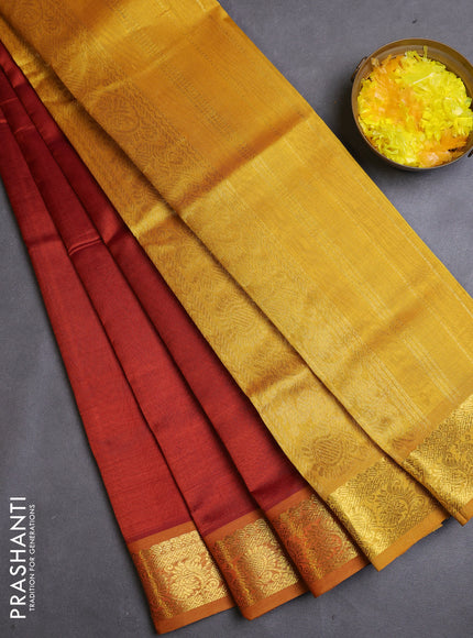 Silk cotton saree rust and mustard yellow with plain body and zari woven border